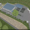 Industrial Factory Building With Blue Roof Surrounding Trees And Green Area Layout