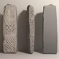 Three Stone Sculpture Carving With Intricate Celtic Knot Geometric Designs And Unfinished Block