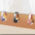 Colorful Headphones Hanging On Brown Shelf With Curtains Perforated Wall And Wooden Floor