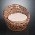 Rattan Leisure Chair with Round Woven Design and Light Colored Cushion for Comfortable Home Seating