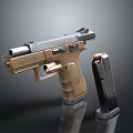 Tan And Silver Metal Pistol With Detachable Magazine On Black Surface