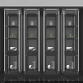 Modern Black and Gold Display Cabinets With Green Boxes White Bowls and Glass Vases