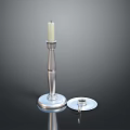 Elegant Silver Candlestick With White Candle And Round Base Design