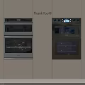 Sleek Modern Kitchen Interior With Built in Ovens White Cabinets And Digital Displays