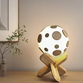 Modern Spherical Table Lamp with Brown Dots and Wooden Cross Base Design