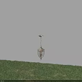 Classic Metal Outdoor Pendant Light With Glass Shade Illuminated Over Grass