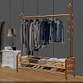 Golden Metal Clothing Rack With Hanging Shirts Jeans Folded Clothes And Shoes In Bedroom