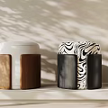 Two Modern Stools With White Brown Wooden Tops And Zebra Pattern Black Bases