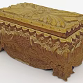 Vintage Carved Wooden Box With Intricate Floral Patterns And Decorative Base