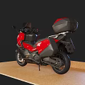 Red Modern Touring Motorcycle With Black Accents And Rear Storage Case