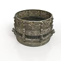 Intricately Carved Metal Sculpture With Ornate Circular Vessel Design And Detailed Engravings