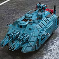Blue Military Armored Vehicle With Multiple Cannons And Top Mounted Equipment