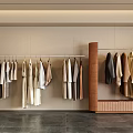 Modern Clothing Store Interior With Hanging Clothes On Racks And Neutral Tones