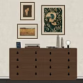 Brown Wooden Cabinet With Multiple Drawers And Framed Artworks Books Vases And Mirror On Top