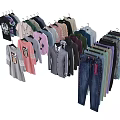 Hanging Clothes Collection Featuring Various Styles T Shirts Shirts And Jeans