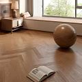 Herringbone Wooden Floor In Room With Open Book Wooden Ball And Window Bench