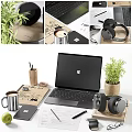 Modern Workspace Setup With Laptop Headphones Coffee Mug Apple And Office Supplies