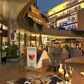 Illuminated Commercial Street with Multi storey Buildings Shops Dining Areas and Green Plants Evening Atmosphere