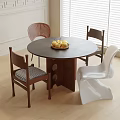 Modern Indoor Round Table And Chairs Set With Wooden And White Chairs And Fruit Bowl