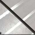 Minimalist Modern Staircase Design Featuring White Concrete Steps And Black Metal Handrail