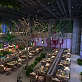 Hotpot Restaurant Interior Design Featuring Green Plants Tree Branch Decor And Stained Glass Windows