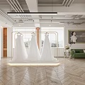 Modern Bridal Shop Interior With White Wedding Dresses On Golden Hangers