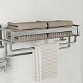 Wall Mounted Bathroom Metal Towel Rack With Brown Towels Beige Striped Towel And Bath Sponge