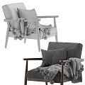 Cozy Gray Armchair With Wooden Frame Pillows And Pom Pom Blanket