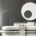 Soft Green Sectional Sofa With Throw Blanket Pillow Circular Wall Art And Potted Plant