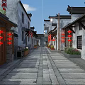 Traditional Chinese Commercial Street With Ancient Architecture Red Lanterns And Stone Paved Path