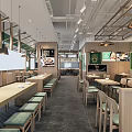 Modern Restaurant Interior With Wooden Long Tables Green Decor Hanging Lights And Seating