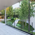 Modern Courtyard Garden With Metal Gate White Wall Green Trees And Black Car