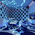Modern KTV Interior With Blue Lighting Geometric Patterned Walls Sofa Coffee Tables And TV Screen