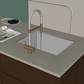 Brass Kitchen Faucet with Black Sink on Light Countertop and Magazines Modern Style