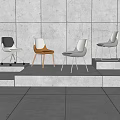Modern Dining Chairs With Various Colors Designs And Wheels On Gray Floor