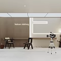 Fashion Clothing Store Interior With Display Area Chairs And Tripod Lighting