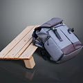 Stylish Gray And Brown Fabric Leather Backpack On Wooden Bench With Modern Design