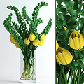 Beautiful Yellow Tulips With Green Leaves In Transparent Glass Vase