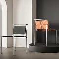 Modern Black and Orange Dining Chairs with Metal Frame in Contemporary Interior Design