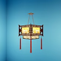 Chinese Style Pendant Lamp With Carved Frame And Tassels Hanging In Blue Wall Corner