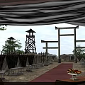 Traditional Stone Torii Gates With Red Carpet Tower Like Structures And Fruit Platter