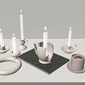 Modern Candle Lamps With Lit Candles White Holders On Black Mat And Pink Cup Saucer