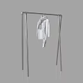 Stylish Clothes Hanging on Metal Rack with White Coat and Scarf