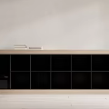 Modern Wooden Bookcase With Black Compartments And Books On Top Shelf