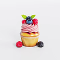 Fresh Cupcake Topped With Pink Frosting Blueberries Raspberries Blackberries Green Leaf And Side Berries