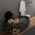 Dark Stone Freestanding Bathtub With Bathrobe On Rack Plants Stool And Wooden Floor Rug