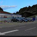 Road Facilities At Mountain Tunnel Entrance With Yellow Barriers And Double Yellow Lines