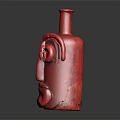 Red Face Shaped Ceramic Vessel With Artistic Eye And Mouth Design On Dark Surface