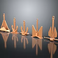 Copper Colored Metal Anchors In Various Shapes And Sizes On Black Reflective Surface