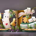 Whimsical Welcome Decoration With Playing Cards Golden Silhouettes Green Plants And Flowers
